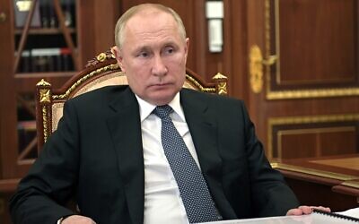 Russian President Vladimir Putin listens during a meeting in Moscow, Russia, March 22, 2022. (Mikhail Klimentyev, Sputnik, Kremlin Pool Photo via AP)