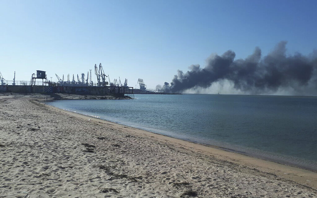Smoke rises after shelling near a seaport in Berdyansk, Ukraine, March 24, 2022. (AP Photo)