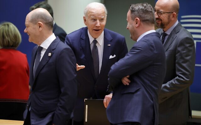 US President Joe Biden, center, speaks with from left, German Chancellor Olaf Scholz, Luxembourg's Prime Minister Xavier Bettel and European Council President Charles Michel during a round table meeting at an EU summit in Brussels, Thursday, March 24, 2022 (AP Photo/Olivier Matthys)