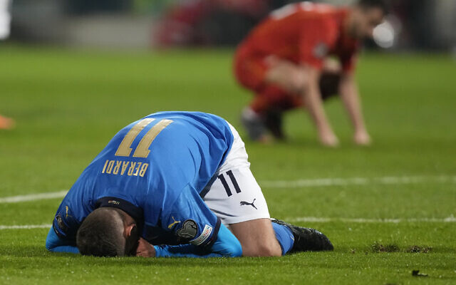 Italy's Domenico Berardi on his knees after missing a scoring chance during the World Cup qualifying play-off soccer match between Italy and North Macedonia, at Renzo Barbera stadium, in Palermo, Italy, Thursday, March 24, 2022. (AP Photo/Antonio Calanni)