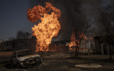 Flames and smoke rise from a fire following a Russian attack in Kharkiv, Ukraine, March 25, 2022. (AP Photo/Felipe Dana)