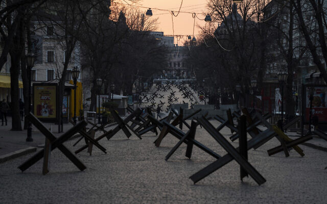 Anti- tank barricades are placed on a street as preparation for a possible Russian offensive, in Odesa, March 24, 2022. (AP Photo/Petros Giannakouris, File)