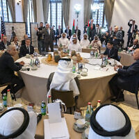 The opening roundtable begins at the Negev Summit, as Foreign Minister Yair Lapid, clockwise from left, makes opening remarks with US Secretary of State Antony Blinken, United Arab Emirates' Foreign Minister Sheikh Abdullah bin Zayed Al Nahyan, Morocco's Foreign Minister Nasser Bourita, Egypt's Foreign Minister Sameh Shoukry, and Bahrain's Foreign Minister Abdullatif bin Rashid al-Zayani, March 28, 2022, in Sde Boker. (AP Photo/Jacquelyn Martin, Pool)