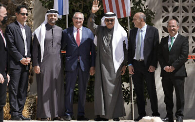 Bahrain's Foreign Minister Abdullatif al-Zayani waves, as he poses for a photo with attendees, following the Negev Summit in Kibbutz Sde Boker, southern Israel, March 28, 2022. Israel hosted the foreign ministers of four Arab nations and the United States in a bid to strengthen its position in a rapidly shifting Middle East. The gathering brought together the top diplomats from all but one of the Arab countries that have normalized relations with Israel in US-mediated negotiations. (AP Photo/Tsafrir Abayov)