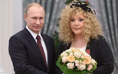 Russian President Vladimir Putin, left, and Russian pop singer Alla Pugacheva pose for a photo during an awards ceremony in Moscow's Kremlin in Moscow, Russia, on December 22, 2014. (AP Photo/RIA-Novosti, Alexei Druzhinin, Presidential Press Service)