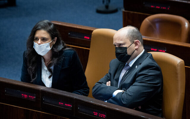 Israeli Prime Minister Naftali Bennett with Interior Minister Ayelet Shaked during a plenum session at the Knesset, the Israeli parliament in Jerusalem, February 28, 2022. (Yonatan Sindel/Flash90)