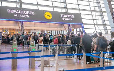 Travelers at the Ben Gurion International Airport, on March 2, 2022. (Yossi Aloni/Flash90)