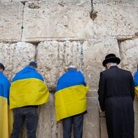 Kyiv's ambassador to Israel, Yevgen Korniychuk, Ukrainian citizens and supporters attend a special prayer session at the Western Wall in Jerusalem's Old City on March 2, 2022, amid Russia's invasion of Ukraine. (Yonatan Sindel/Flash90)