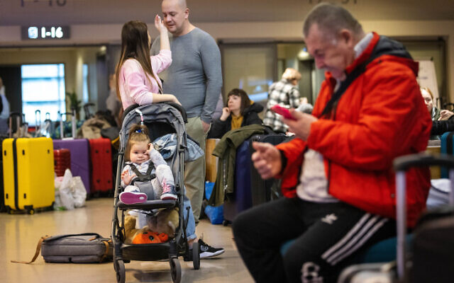 Jewish Ukrainians are seen leaving a hotel in Warsaw, Poland, to head to the airport to board a plane for Israel on March 6, 2022. (Olivier Fitoussi/Flash90)