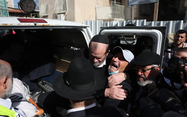 Mourners at the funeral of Avishai Yehezkel, who was killed in a terror attack in Bnei Brak, March 30, 2022 (Yonatan Sindel/Flash90)