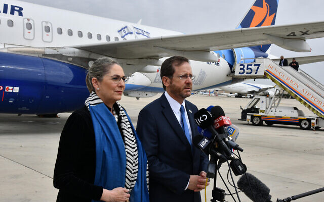 President Isaac Herzog speaks to reporters before departing for a visit to Turkey on March 9, 2022. (Haim Zach/GPO)