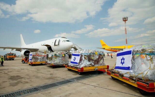 Equipment for an Israeli field hospital set to be built in the western Ukrainian city of Mostyska is loaded onto a plane at Ben Gurion Airport, March 17, 2022. (Sivan Shahar/Anaba/GPO)