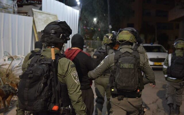 Police arrest an individual in connection with the Hadera attack, March 28, 2022. (Israel Police)