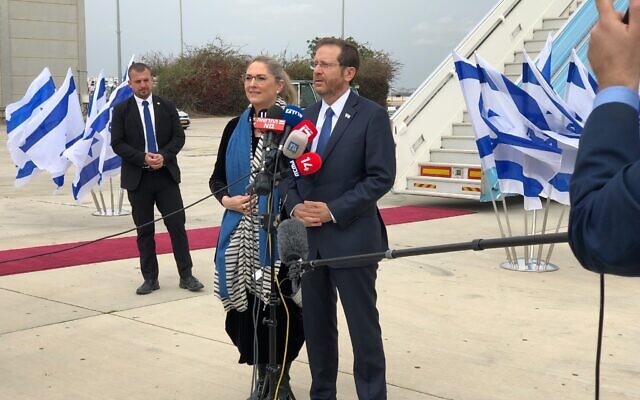 President Isaac Herzog speaks to reporters before departing for a visit to Turkey on March 9, 2022 (Tal Schneider)