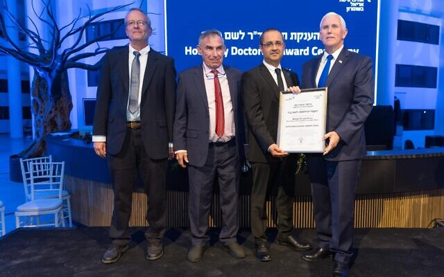 Mike Pence (R) is awarded an honorary doctorate at Ariel University in the West Bank, March 9, 2022. (Liron Modovan/Ariel University)