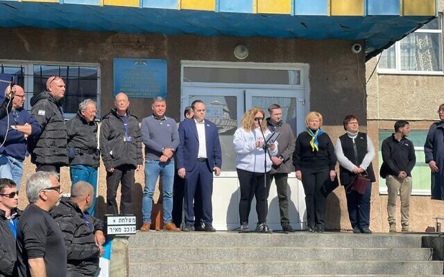 Medical staff, Ukrainian and Israeli government representatives, and patients on site at Israel's state field hospital in Mostyska, Ukraine, which opened on Tuesday afternoon, March 22, 2022. (Carrie Keller-Lynn/The Times of Israel)