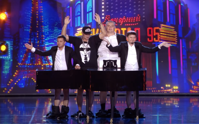 Ukrainian President Volodymyr Zelensky (far left) performs a medley of songs, including 'Hava Nagila,' with a comedy troupe on stage in a performance from 2016. (Screenshot/YouTube)