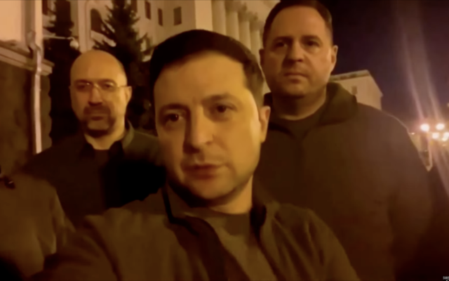 Ukraine President Volodymyr Zelensky posts a video of himself and his team outside the presidential headquarters in Kyiv on February 25, 2022. The author is behind him on the right. (Screen capture/Twitter)