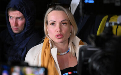 Marina Ovsyannikova, the editor at the state broadcaster Channel One who protested against Russian military action in Ukraine during the evening news broadcast at the station late Monday, speaks to the media as she leaves the Ostankinsky District Court in Moscow, March 15, 2022. (AFP)
