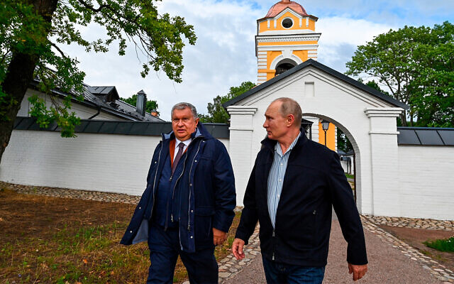 Russian President Vladimir Putin, right, and Russian oligarch Igor Sechin visit the Konevsky Monastery north of St. Petersburg, Russia, July 31, 2021. (Alexei Nikolsky, Sputnik, Kremlin Pool Photo via AP)