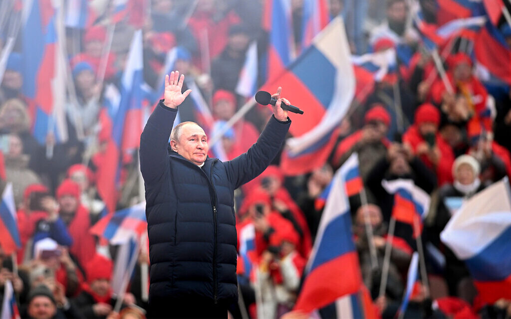 Russian President Vladimir Putin greets people after his speech at the concert marking the eighth anniversary of the referendum on the state status of Crimea and Sevastopol and its reunification with Russia, in Moscow, Russia, March 18, 2022. (Ramil Sitdikov/Sputnik Pool Photo via AP)