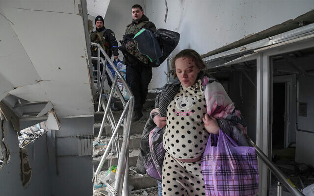An injured pregnant woman in a maternity hospital hit by Russian shelling in Mariupol, Ukraine, March 9, 2022. (AP Photo/Evgeniy Maloletka)