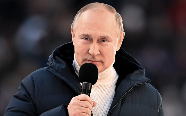 Russian President Vladimir Putin delivers a speech at a concert marking the eighth anniversary of the referendum on the state status of Crimea and Sevastopol and its reunification with Russia, in Moscow, Russia, March 18, 2022. (Ramil Sitdikov/Sputnik Pool Photo via AP)