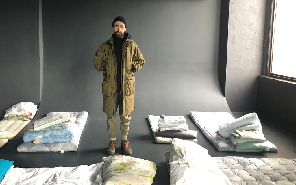 Roman Slutin, founder of Zavod, stands in his studio, which nows serves a temporary home for Ukrainian refugees, March 8, 2022. (Lazar Berman/The Times of Israel)