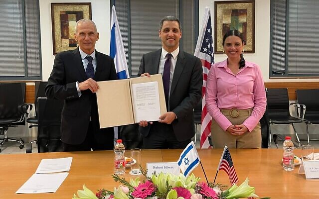 Public Security Minister Omer Barlev, US Department of Homeland Security Under Secretary for Policy Robert Silvers and interior Minister Ayelet Shaked sign an information-sharing agreement in Jerusalem on March 2, 2022. (Courtesy)