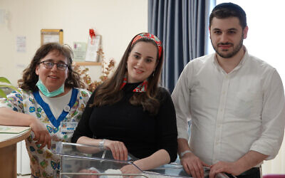 Hani Kochav-Lev (center) and her husband Eliezer, with their new baby and nurse Renanit Berman at Shaare Zedek Medical Center (courtesy of Shaare Zedek Medical Center)