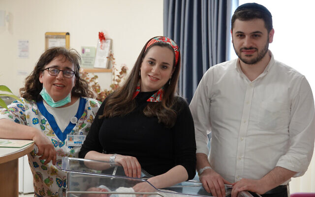 Hani Kochav-Lev (center) and her husband Eliezer, with their new baby and nurse Renanit Berman at Shaare Zedek Medical Center (courtesy of Shaare Zedek Medical Center)