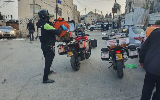 Police officers and medics at the scene of a suspected stabbing attack in East Jerusalem's Ras al-Amud, March 20, 2022. (Rescuers Without Borders)