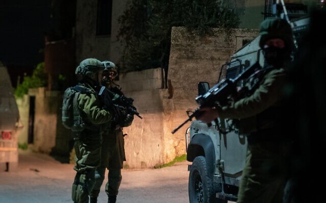 Illustrative: IDF soldiers operating in the West Bank Palestinian town of Silat al-Harithiya, on December 20, 2021. (Israel Defense Forces)
