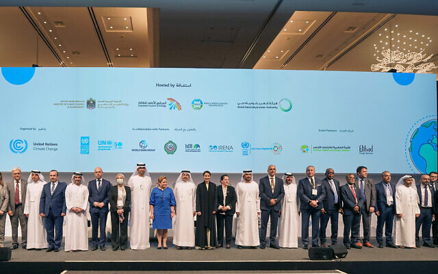 Patricia Espinosa, executive secretary of the United Nations Framework Convention on Climate Change (in blue), is flanked by dignitaries and environment ministers at the first Middle East and North Africa Climate Week in Dubai, United Arab Emirates, March 28, 2022. (Courtesy, UNFCCC)