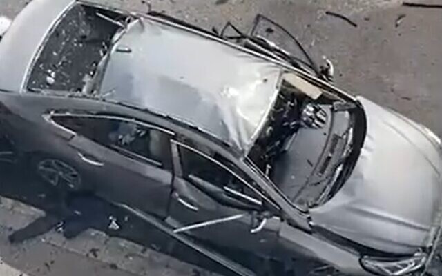 The aftermath of a car bombing in Haifa, on March 11, 2022. (Screengrab/Walla)