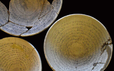 Three 1,500-year-old 'magic' incantation bowls created in the 5th-7th centuries in present day Iraq that were seized from an alleged illegal antiquities' dealer's home in Jerusalem (Yoli Schwartz, Israel Antiquities Authority)