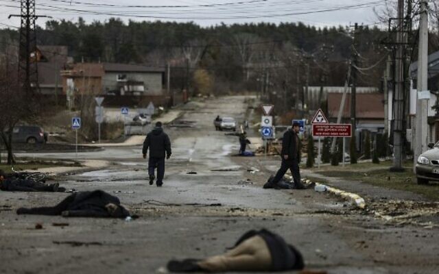 Bodies lie on a street in Bucha, northwest of Kyiv, as Ukraine says Russian forces are making a 'rapid retreat' from northern areas around Kyiv and the city of Chernihiv, on April 2, 2022. (Ronaldo Schemidt/AFP)