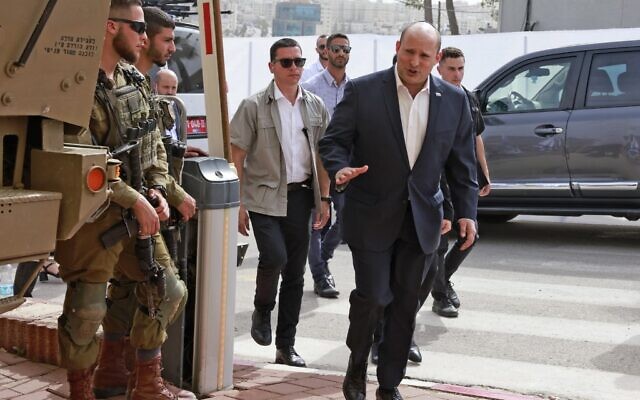 Prime Minister Naftali Bennett arrives at the Beit El army headquarters in the West Bank, on April 5, 2022. (Menahem Kahana/AFP)