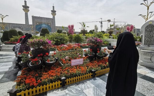 Iranians visit the spot in the courtyard of Imam Reza shrine in the northeastern city of Mashhad on April 6, 2022, where a day earlier a Muslim cleric was killed. (Hadis Faghiri/Fars News/AFP)