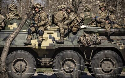 Ukrainian soldiers sit on a armored military vehicle in the city of Severodonetsk, Donbas region, on April 7, 2022. (FADEL SENNA / AFP)