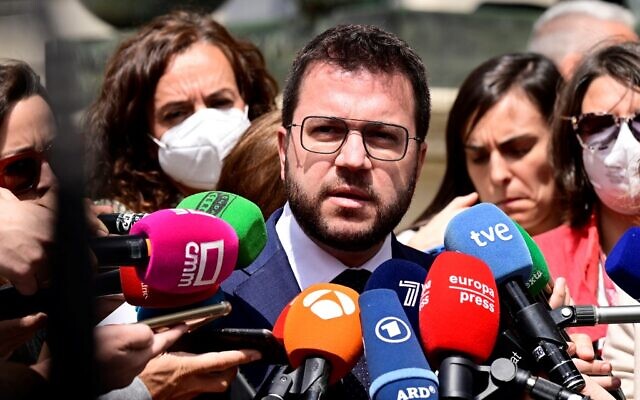 Catalan regional president Pere Aragones talks to the press in front of the Palacio de las Cortes congress in Madrid on April 21, 2022. (Javier Soriano/AFP)