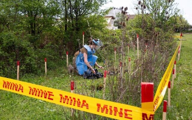 Anastasiia Minchukova attends a demining training near the town of Peja on April 25, 2022. (Photo by AFP)