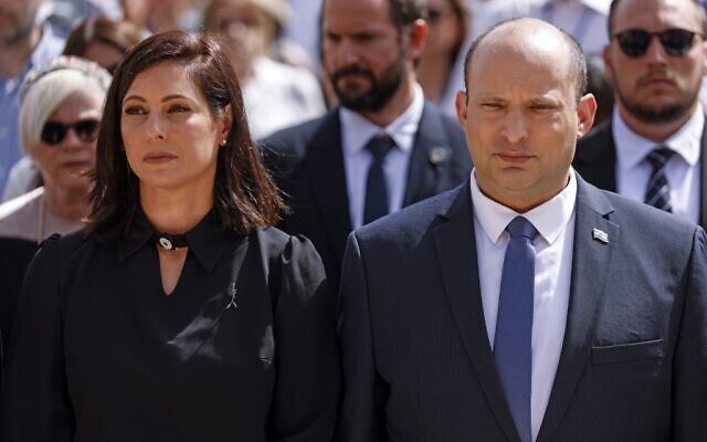Prime Minister Naftali Bennett and his Wife Galit take part in the ceremony marking Holocaust Remembrance Day at Warsaw Ghetto Square at Yad Vashem memorial in Jerusalem, on April 28, 2022. (AMIR COHEN / POOL / AFP)