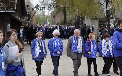 Holocaust survivors take part in The March of the Living in honour of the victims of the Holocaust, at the site of the Memorial and Museum Auschwitz-Birkenau in Oswiecim, Poland, on April 28, 2022. (Wojtek Radwanski/AFP)