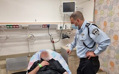 A police officer hospitalized after being wounded in a stabbing attack in Ashkelon, April 12, 2022 (Israel police)