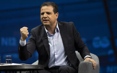 Joint List head MK Ayman Odeh gestures as he speaks during a conference in Jerusalem, on March 7, 2021. (AP Photo/Sebastian Scheiner)