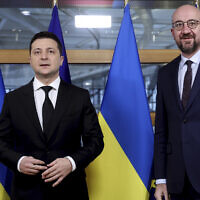 Illustrative: European Council President Charles Michel, right, greets Ukraine's President Volodymyr Zelensky prior to a bilateral meeting on the sidelines of an Eastern Partnership Summit in Brussels, on December 15, 2021. (Kenzo Tribouillard, Pool Photo via AP)