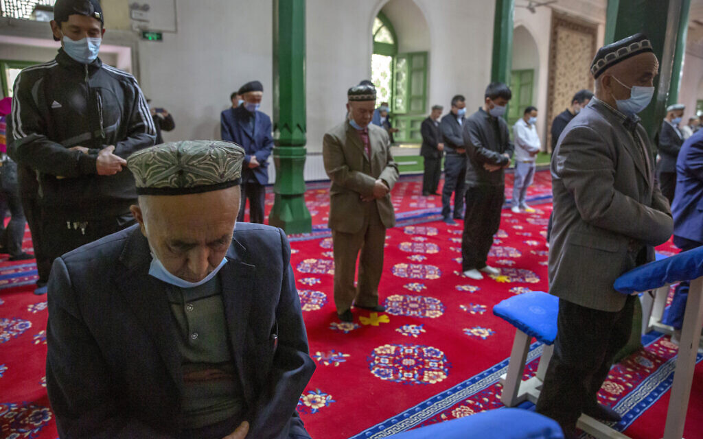 Uyghurs and other members of the faithful pray during services at the Id Kah Mosque in Kashgar in far west China's Xinjiang region, as seen during a government organized visit for foreign journalists on April 19, 2021. (AP Photo/Mark Schiefelbein, File)
