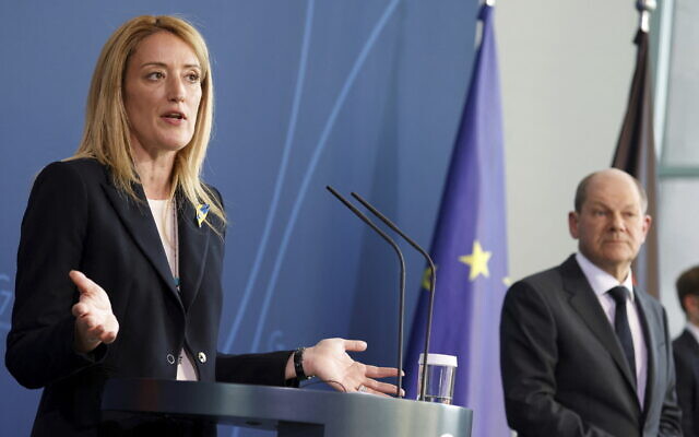 German Chancellor Olaf Scholz and European Parliament President Roberta Metsola address the media during a joint statement at the Chancellery in Berlin, Germany, Tuesday, March 22, 2022. (Michele Tantussi/Pool photo via AP)