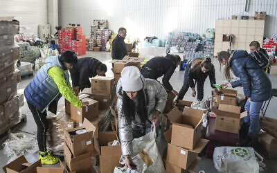 Illustrative: Volunteers sort humanitarian aid in Zaporizhia, Ukraine, March 22, 2022. (AP Photo/Evgeniy Maloletka)